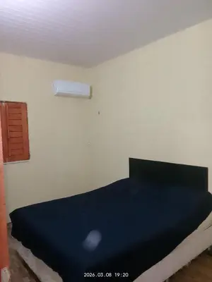 Uma cama ou camas num quarto em PC temporada casa próximo alguns pontos turístico