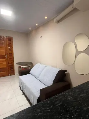 Uma cama ou camas num quarto em Kit net da flor