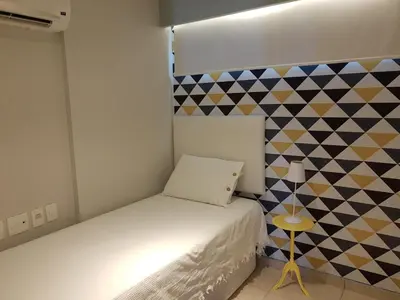 Uma cama ou camas num quarto em Apto Charmoso Praia do Futuro - Fortaleza CE