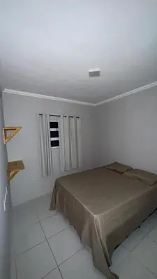 Uma cama ou camas num quarto em Condomínio Avenida