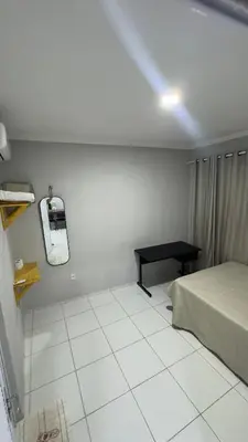 Uma cama ou camas num quarto em Condominio Avenida