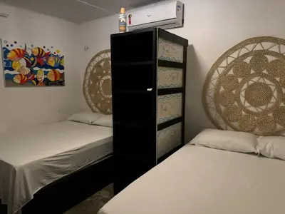 Uma cama ou camas num quarto em Casas do Ton na Praia da Redonda