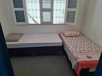 Uma cama ou camas num quarto em Casa do Milota