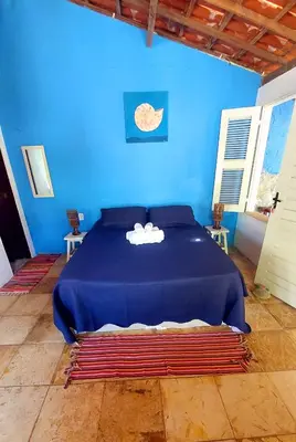 Uma cama ou camas num quarto em Chalé Jasmine Taiba