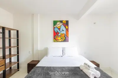 Uma cama ou camas num quarto em Ed Cumbuco Real | Aptos Completos a 160m da Praia - MCUs