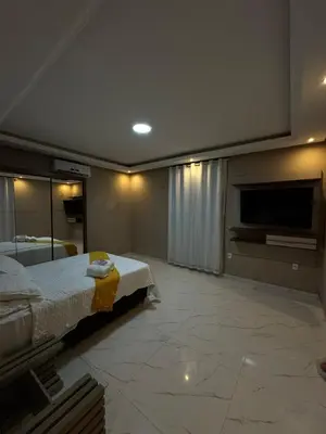 Uma cama ou camas num quarto em Lindo sobrado com piscina perto do mar