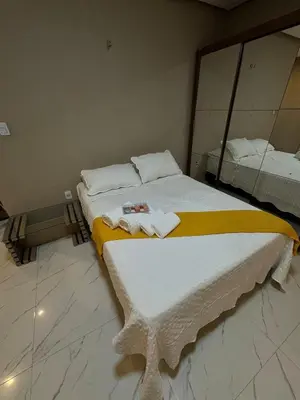 Uma cama ou camas num quarto em Lindo sobrado com piscina perto do mar