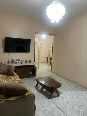 Uma televisão e/ou sistema de entretenimento em Suites da Ana Flecheiras
