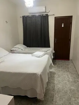 Uma cama ou camas num quarto em Suites da Ana Flecheiras