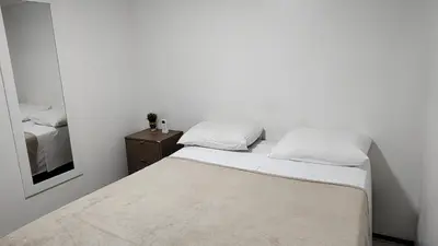 Uma cama ou camas num quarto em Excelente apto confortável 4 hóspedes