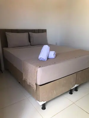 Uma cama ou camas num quarto em Pousada casa sonho do mar