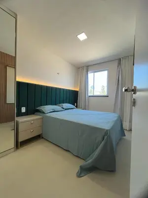 Uma cama ou camas num quarto em Condomínio SUNLIT RESIDENCE