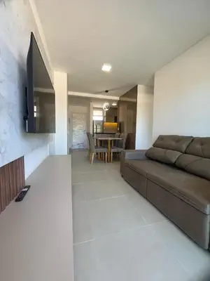 Uma televisão e/ou sistema de entretenimento em Condomínio SUNLIT RESIDENCE