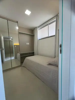 Uma cama ou camas num quarto em Condomínio SUNLIT RESIDENCE