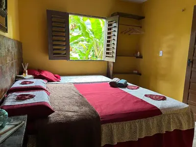 Uma cama ou camas num quarto em Chalé Luz de São Miguel