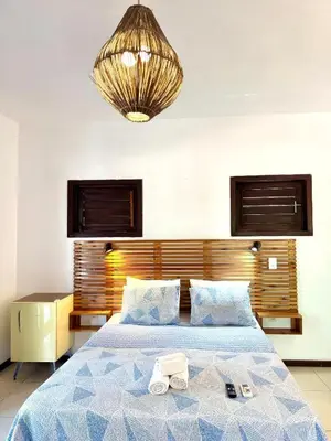Uma cama ou camas num quarto em Villa Puglia Jeri Suítes