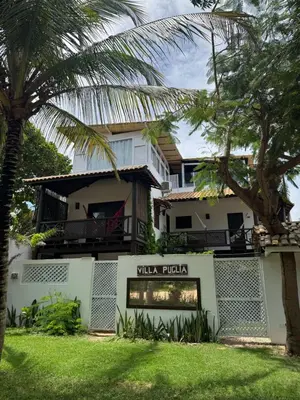 Um jardim no exterior de Villa Puglia Jeri Suítes