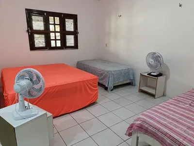 Uma cama ou camas num quarto em Presídio Beach House