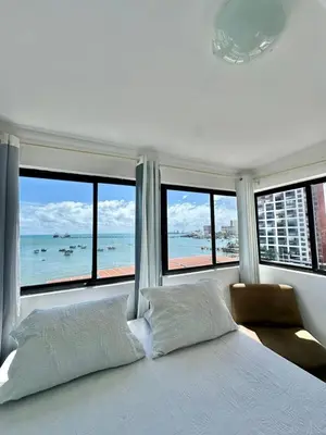 Uma cama ou camas num quarto em Vista Mar-Ocean Tower Flat