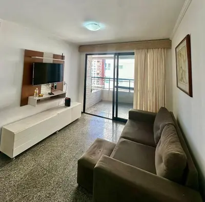 Uma televisão e/ou sistema de entretenimento em Vista Mar-Ocean Tower Flat