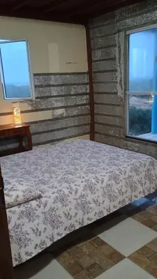 Uma cama ou camas num quarto em Pedacinho dCéu - entre a praia e a lagoa