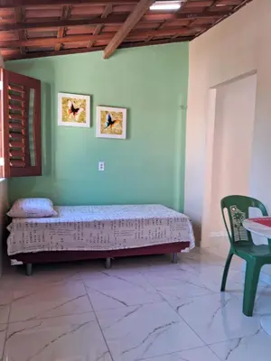 Uma cama ou camas num quarto em Chalé da Ana