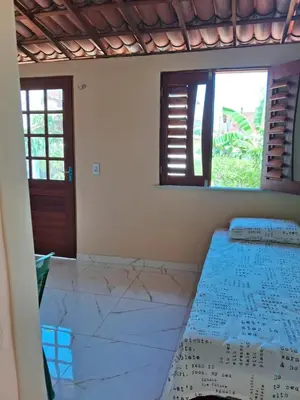 Uma cama ou camas num quarto em Chalé da Ana