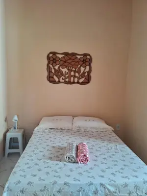 Uma cama ou camas num quarto em Chalé da Ana