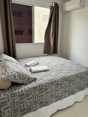 Uma cama ou camas num quarto em Apartamento Fortaleza Beira-mar praia do futuro