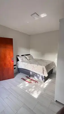 Uma cama ou camas num quarto em Casa do reginaldo