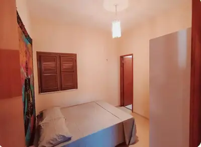Uma cama ou camas num quarto em Conforto em Praia Paradisíaca