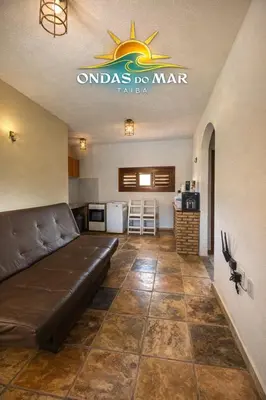Uma área de estar em Apartamento Ondas do Mar - Taíba
