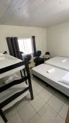 Uma cama ou camas num quarto em Casa de Praia no Icaraí a 100m da praia