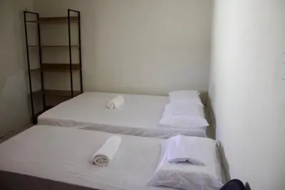 Uma cama ou camas num quarto em Casa de Praia no Icaraí a 100m da praia