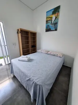 Uma cama ou camas num quarto em Casa Horizonte Azul