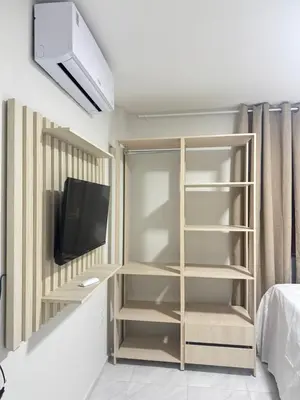 Uma televisão e/ou sistema de entretenimento em Via do Sol flats