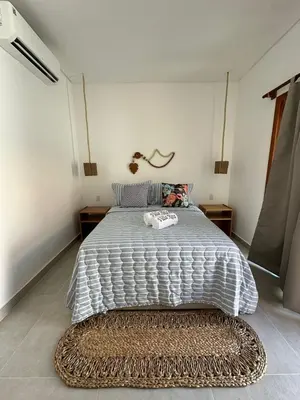 Uma cama ou camas num quarto em Villa Rita - Preá