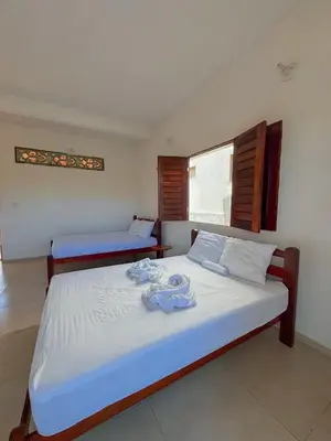 Uma cama ou camas num quarto em ALBERGUE Lagoinha