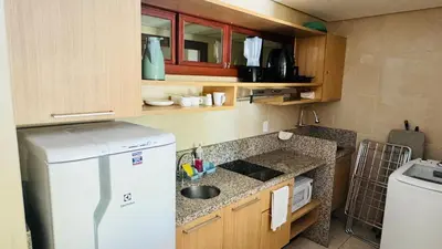 A cozinha ou kitchenette de Apto Frente Piscina em Kariri Beach