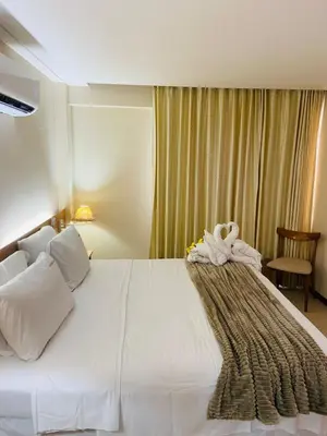 Uma cama ou camas num quarto em Apto Frente Piscina em Kariri Beach