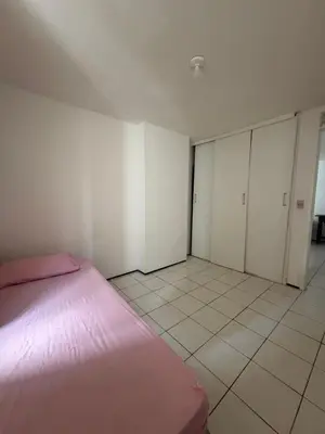 Uma cama ou camas num quarto em Apartamento beira mar sol maior