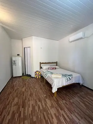 Uma cama ou camas num quarto em Chalé central beach