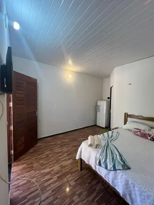Uma cama ou camas num quarto em Chalé central beach