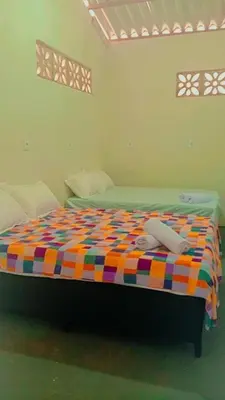 Uma cama ou camas num quarto em Chalé central beach