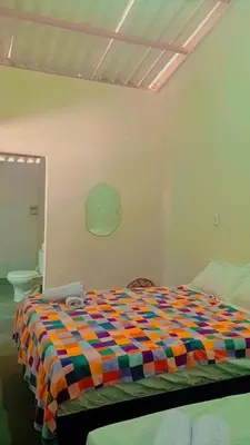 Uma cama ou camas num quarto em Chalé central beach
