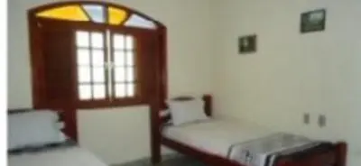 Uma cama ou camas num quarto em Aconchego da serra no centro de Pacoti