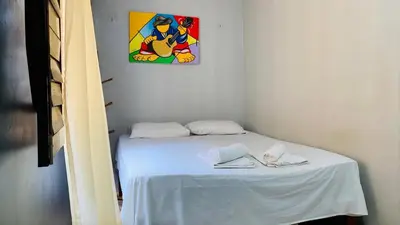 Uma cama ou camas num quarto em Pousada Anauá Jericoacoara