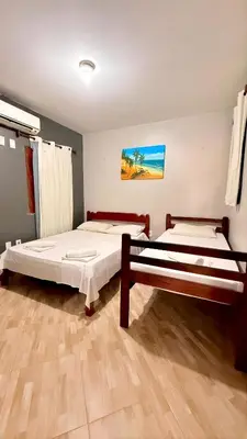 Uma cama ou camas num quarto em Pousada Anauá Jericoacoara
