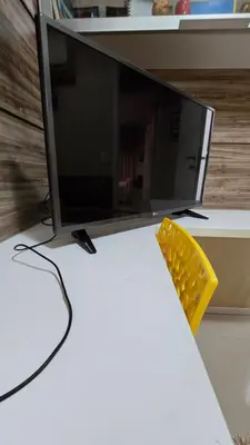 Uma televisão e/ou sistema de entretenimento em Quarto Aconhegante