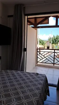 Uma cama ou camas num quarto em Flats Vento da Serra